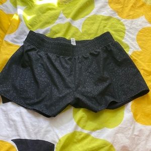 black shorts with subtle cheetah print